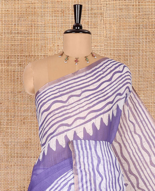 Lavender plain linen cotton saree, temple zig-zag striped batik printed border, batik printed pallu, and triangle motifs batik printed blouse