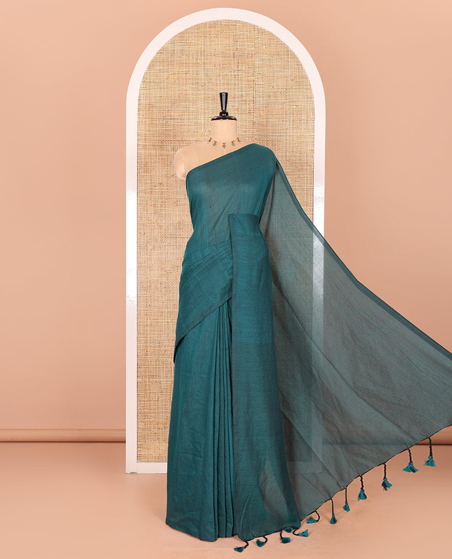 Borderless Peacock Color Plain Khadi Mul Cotton Saree Features a Self-Pallu with Tassels, and a Matching Blouse