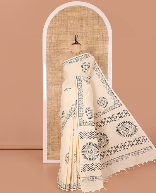 Cream South Cotton Saree Featuring Warli-Village Theme Printed All Over Its Body, Subtly Sparked with Warli Printed Border, and Paired with a Contrast Patola-Style Printed Blouse