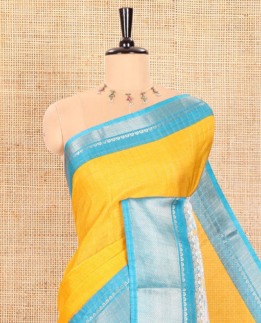 Yellow Dola Silk Saree Decorated with Checks and Madhubani Village-Style Prints, Complemented by a Contrast Border of Traditional Zari Designs, Pallu of Madhubani Prints, and Paired with a Contrast Printed Blouse