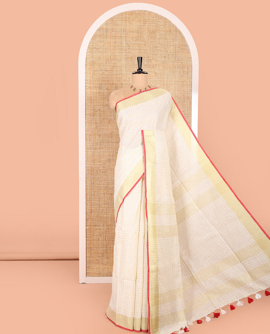 Cream and Red Linen Saree Sparsely Sparkled with Checks, Subtly Designed Zari Border, Zari Striped Pallu, and Paired with a Contrast Blouse