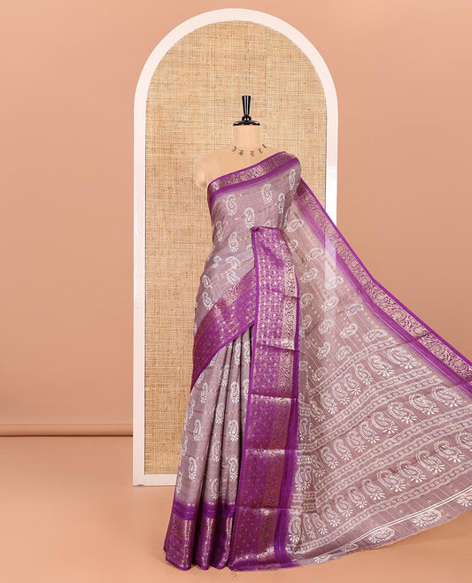 Mauve Dola Silk Saree Elevated with Paisley Buttas, and Horizontal Zari Stripes All Over Its Body, Complemented by Contrast Floral Creeper Zari Design Border, Pallu Steeped with Paisleys, and Paired with a Contrast Blouse