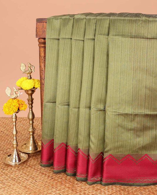 Green banarasi jute silk saree with contrast temple border & striped pallu along with contrast blouse