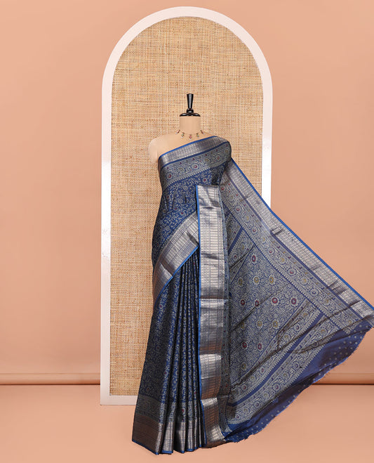 Blue Dola Silk Saree, Subtly Designed with Floral Jaal Print All Over Its Body, Highlighted by Traditional Zari Designs Woven Border, Pallu Replicates the Same Body Print, and Comes with a Matching Blouse