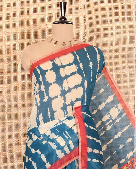 Peacock Blue Mercerised Cotton Saree, Decked Up with Shibori Printed on Its Body, Complemented by a Contrast Border, Pallu Steeped with Colorful Floral Print, and Paired with a Contrast Printed Blouse