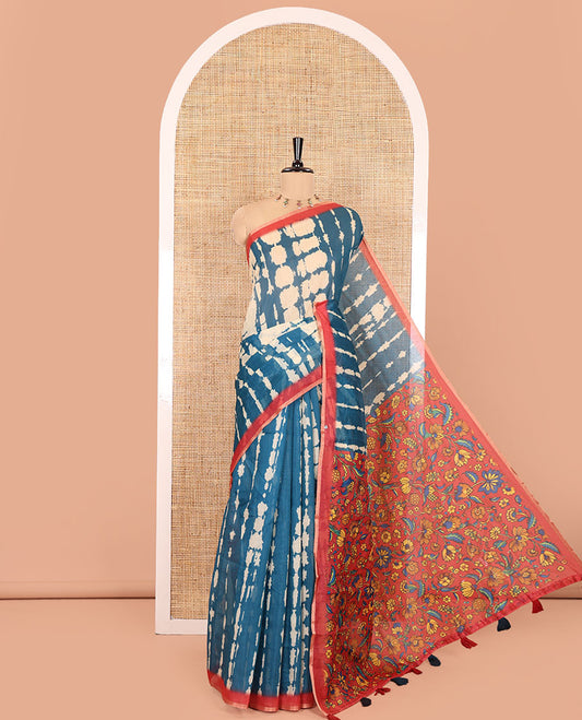 Peacock Blue Mercerised Cotton Saree, Decked Up with Shibori Printed on Its Body, Complemented by a Contrast Border, Pallu Steeped with Colorful Floral Print, and Paired with a Contrast Printed Blouse