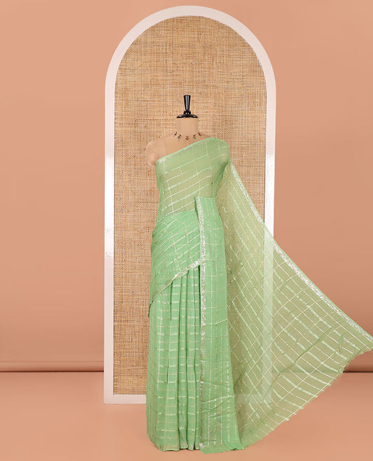Green Chinon Chiffon Saree, Prettified with Gold Zari Checked Design on Its Body, Self-Pallu, and Paired with a Contrast Elephant-Tree-Themed French Knot Embroidered Blouse
