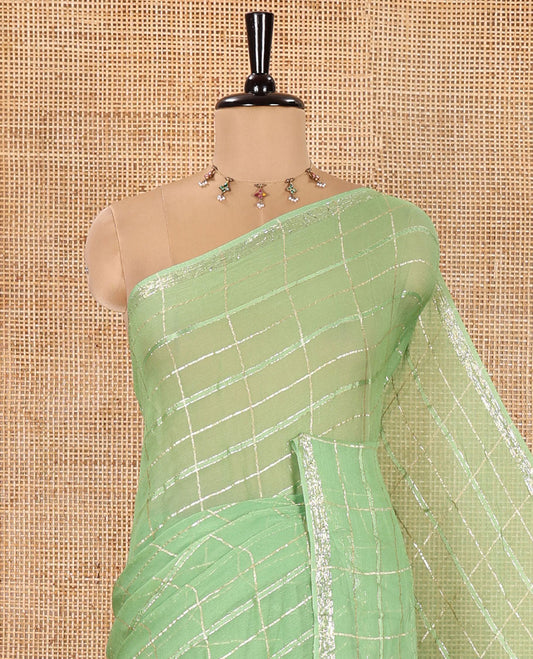 Green Chinon Chiffon Saree, Prettified with Gold Zari Checked Design on Its Body, Self-Pallu, and Paired with a Contrast Elephant-Tree-Themed French Knot Embroidered Blouse