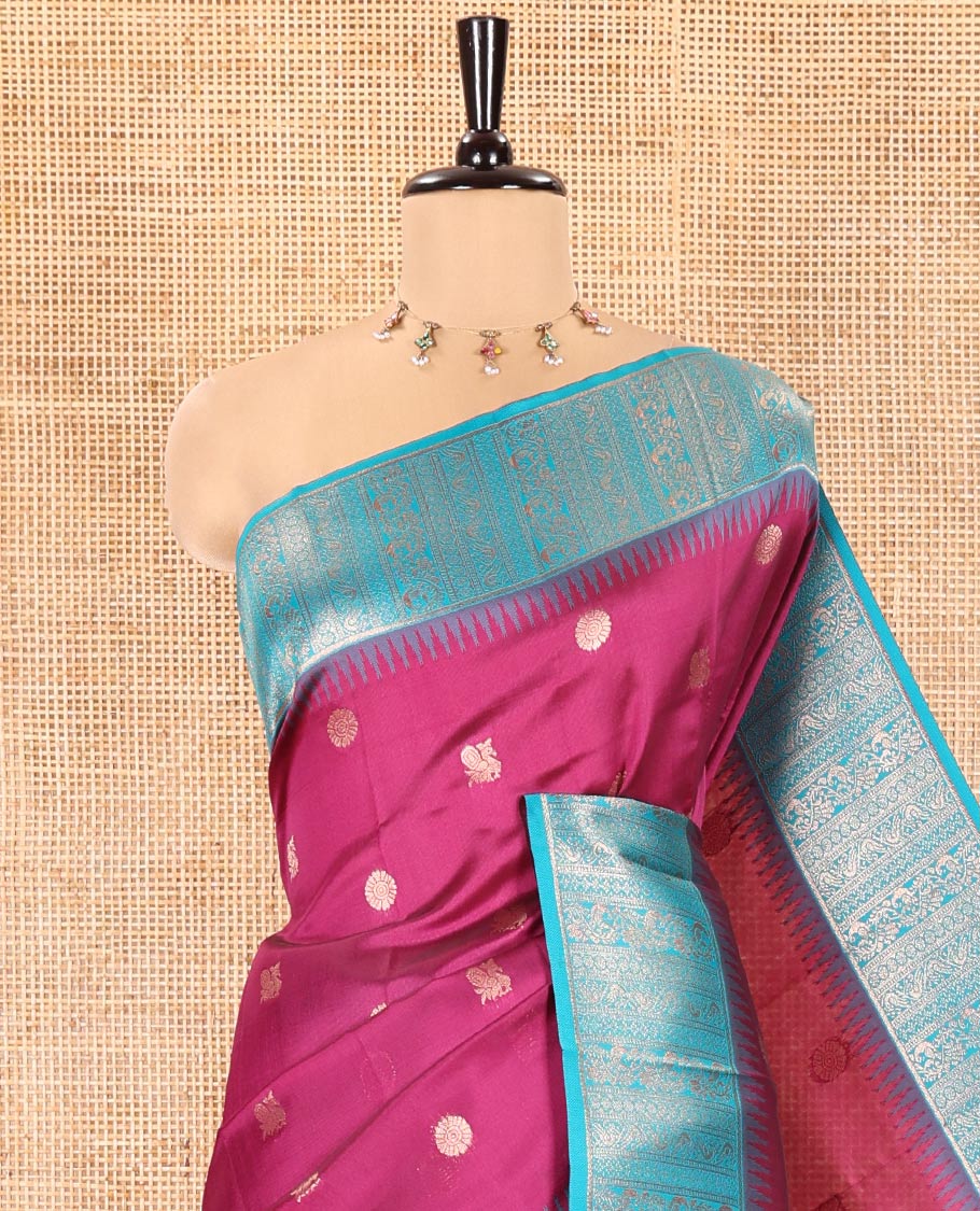 Pink Kanchi Silk Saree, Detailed with Peacock-Chakram Buttas All Over Its Body, Complemented by a Contrast Border of Floral Creeper Designs, an Intricately Designed Pallu, and Paired with a Matching Blouse