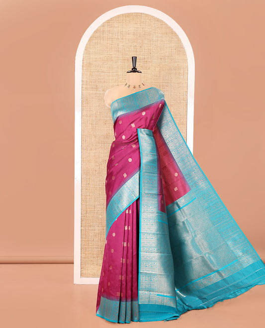 Pink Kanchi Silk Saree, Detailed with Peacock-Chakram Buttas All Over Its Body, Complemented by a Contrast Border of Floral Creeper Designs, an Intricately Designed Pallu, and Paired with a Matching Blouse