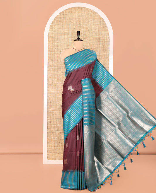 Wine Elite Soft Silk Saree, Elevated with Zari Buttas All Over Its Body, Complemented by Contrast Border Steeped with Geometric Patterns, Grand Pallu, and Paired with a Contrast Blouse