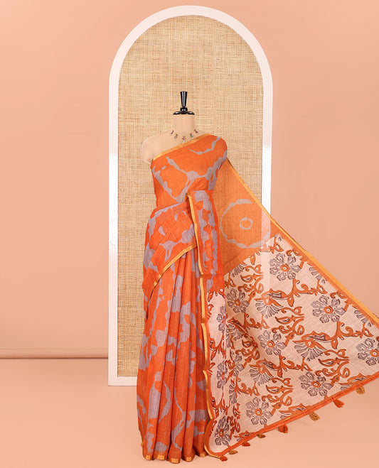 Orange Linen Cotton Saree, Enthralled with Shibori Printed on Its Body, Subtle Piping Border, Pallu of Floral Vine Print, and Paired with a Contrast Floral Vine Printed Blouse