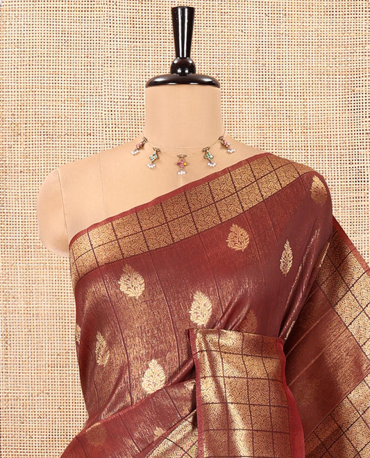 Brown Kanchi Silk Saree, Mesmerized with Zari Buttas All Over Its Body, Highlighted by Zari Checked Border, a Grandly Decked Up Pallu, and Paired with a Chevron Jacquard Blouse