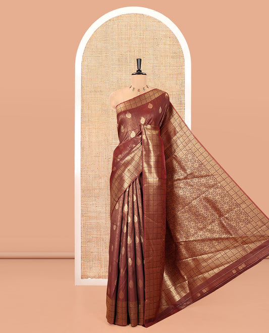 Brown Kanchi Silk Saree, Mesmerized with Zari Buttas All Over Its Body, Highlighted by Zari Checked Border, a Grandly Decked Up Pallu, and Paired with a Chevron Jacquard Blouse