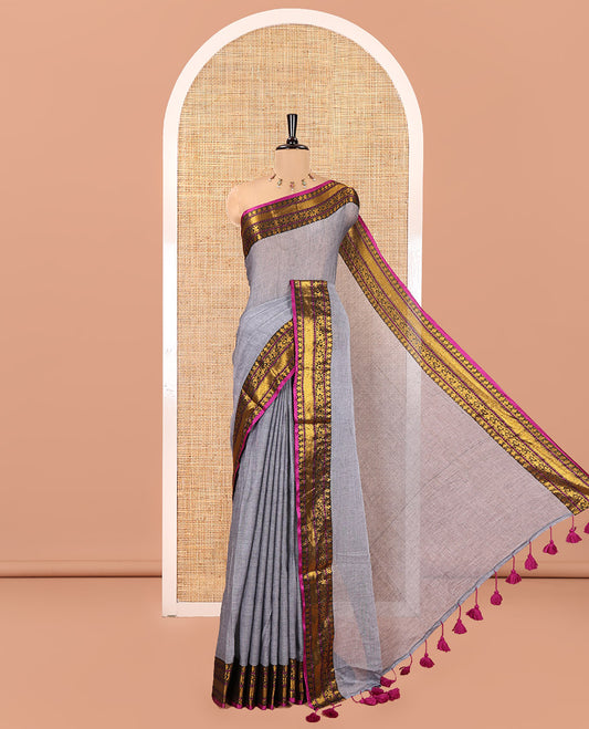 Grey Plain Khadi Mul Cotton Saree, Complemented by a Contrast Traditional Zari Border, a Self-Pallu, and Paired with a Matching Blouse