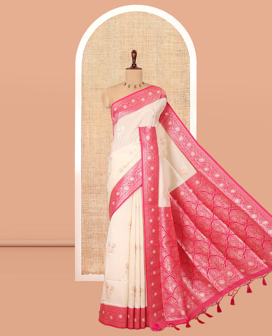 Cream-Rani Pink  Elite Soft Silk Saree, Embellished with Zari Buttas, a Contrast Floral Creeper Border, Intricate Pallu, and a Contrast Blouse