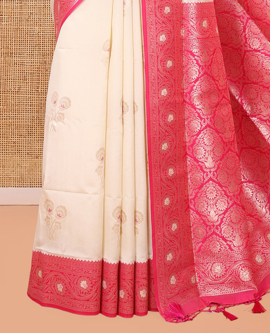 Cream-Rani Pink  Elite Soft Silk Saree, Embellished with Zari Buttas, a Contrast Floral Creeper Border, Intricate Pallu, and a Contrast Blouse