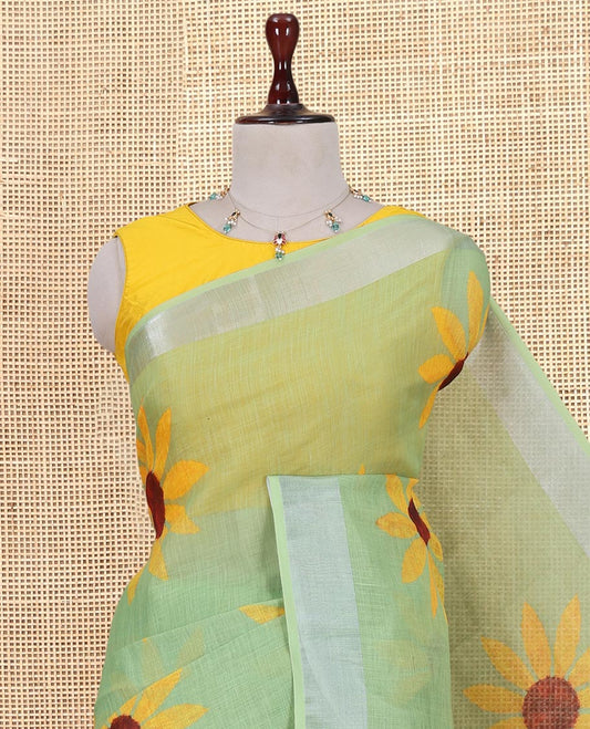 Green Linen Cotton Saree, Beautified with Sunflower Print, a Zari Border, and a Matching Blouse