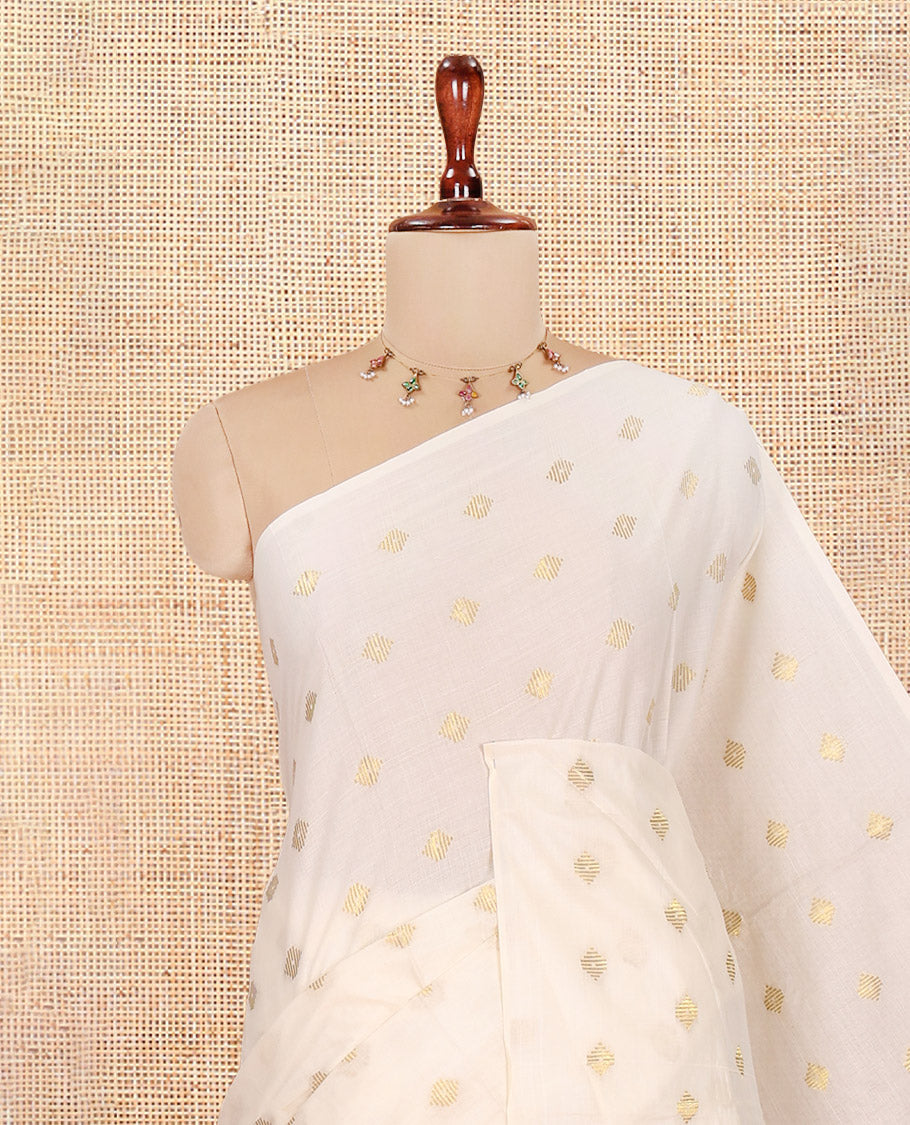 Borderless Cream Kerala Cotton Saree, Adorned with Zari Buttas, a Self-Pallu, and a Matching Blouse