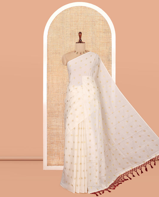 Borderless Cream Kerala Cotton Saree, Adorned with Zari Buttas, a Self-Pallu, and a Matching Blouse