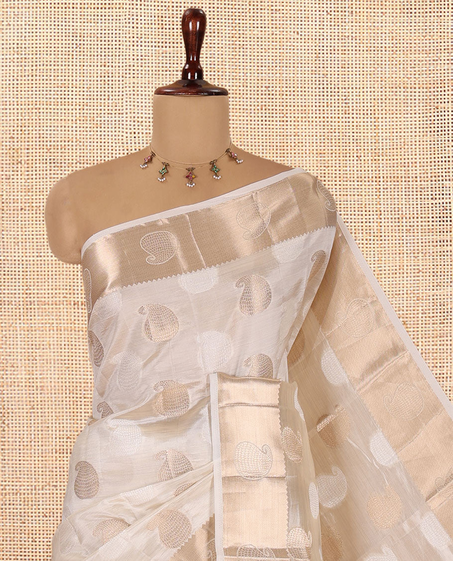 Cream Semi-Tussar Saree Features Paisley Buttas, a Zari Paisley Border, and a Matching Blouse