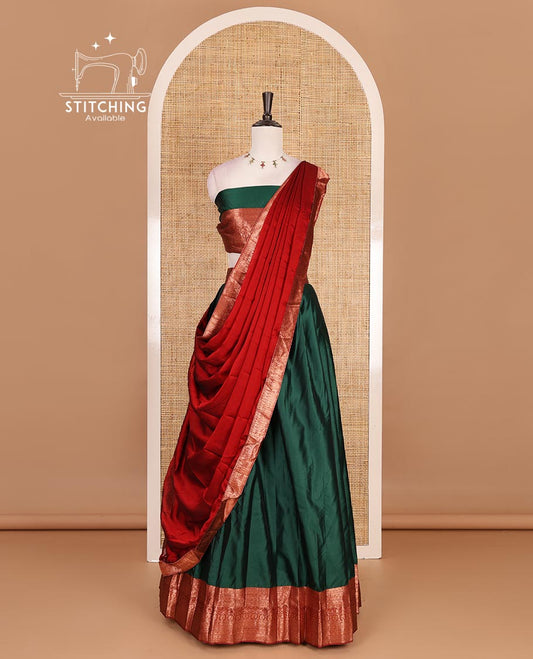 Dark green taffeta silk half saree, plain with contrast red traditional zari border, matching zari blouse, and contrast plain zari border dhavani