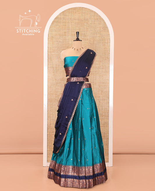 Rama Green and Blue Semi-Banarasi Half-Saree, Accentuated with Zari Buttas on Its Skirt, Complemented by a Contrast Rettai Pettu Traditional Zari-Design Border, Paired with a Matching Blouse, and Comes with a Contrast Satin Georgette Embroidered Dhavani