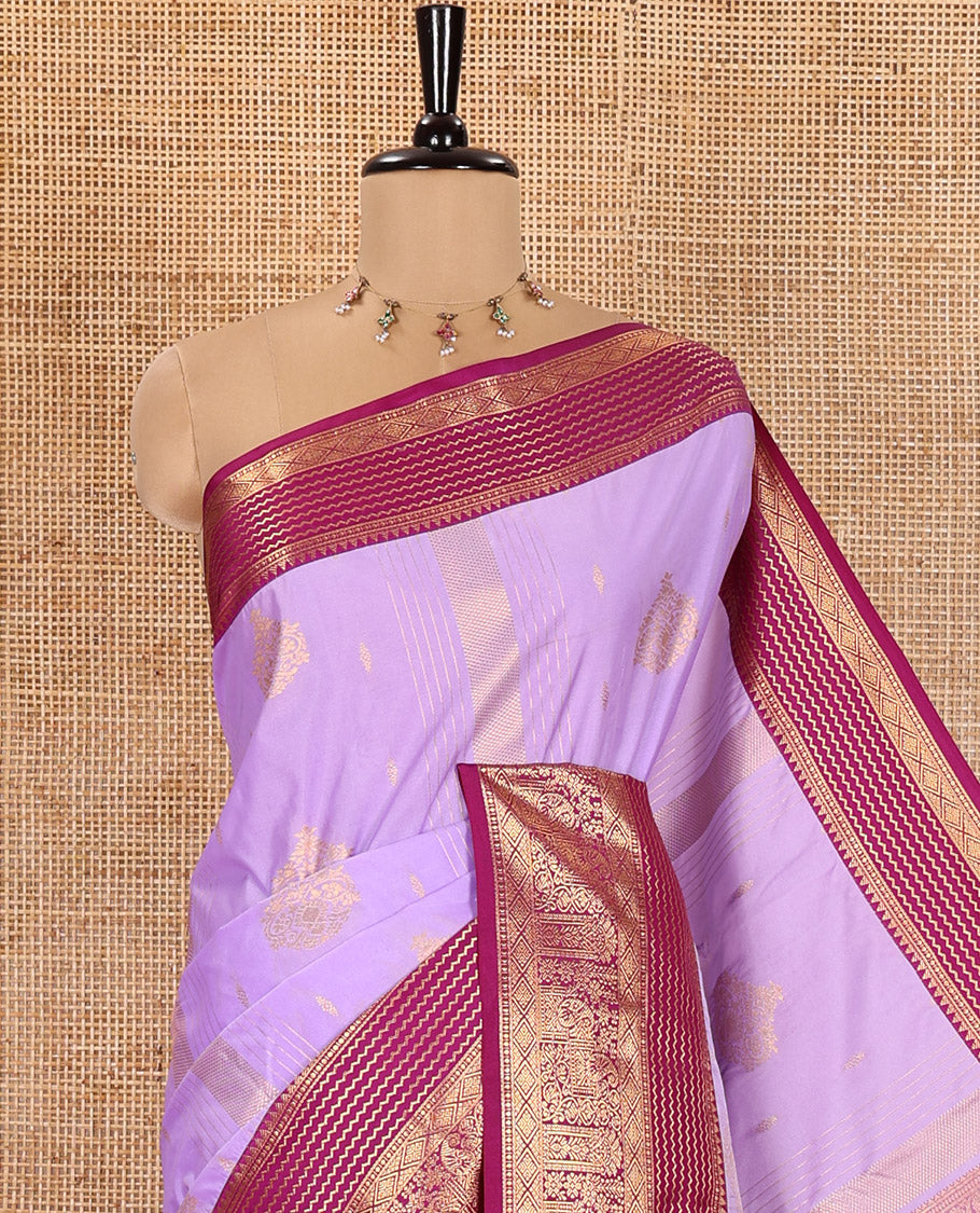 Lavender Kanchipuram Budget Silk Saree, Accentuated with Zari Buttas and Zari Stripes All Over Its Body, Complemented by a Contrast Traditional Zari Design Border, Zari-Rich Jaal Pallu, and Paired with a Contrast Blouse