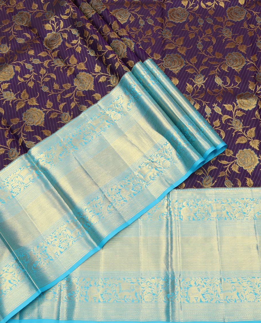 Violet Pure Silk Half-Saree, Gracefully Embellished with Floral Jacquard All Over Its Skirt, Complemented by a Contrast Border of Mayil, Yaanai, Mayil Kann, and Jaal Designs, Paired with a Contrast Blouse, and Comes with a Zari Design Dhavani