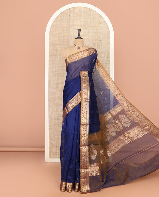 Blue Silk Cotton Saree Prettified with Buttas All Over the Body, Complemented by a Contrast Floral Creeper Zari Border, Featuring a Contrast Pallu of Floral Zari Designs, and Paired with a Contrast Blouse