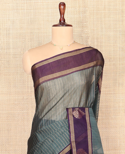 Grey Silk Cotton Saree, Subtly Sparkled With Stripes All Over Its Body Complemented by Contrast Zari Motifs Woven Border, Geometric Patterned Pallu and Paired with a Contrast Blouse
