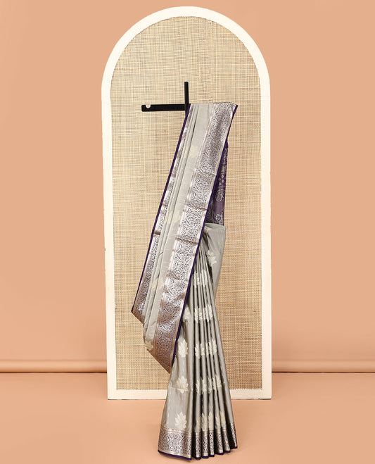 Grey stripes, and leaf buttas soft silk saree, contrast floral zari design border, and paisley design pallu