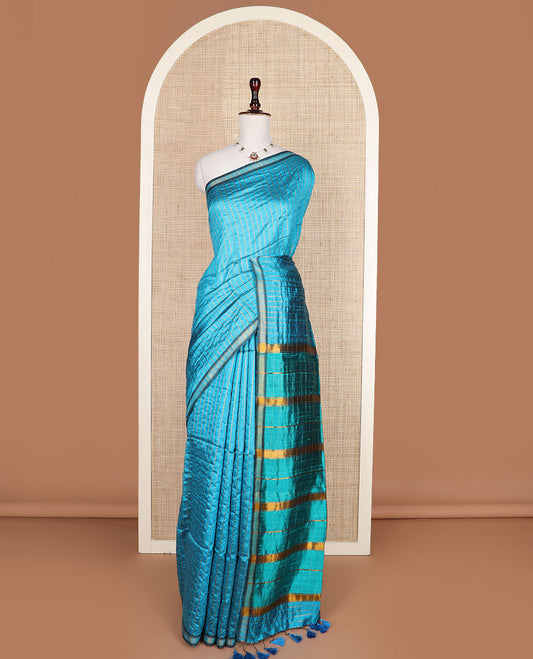 Blue checked tussar silk saree, zari border, and contrast striped pallu