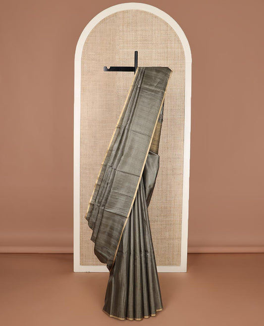 Borderless graphite grey sparsely striped tussar silk saree, striped pallu