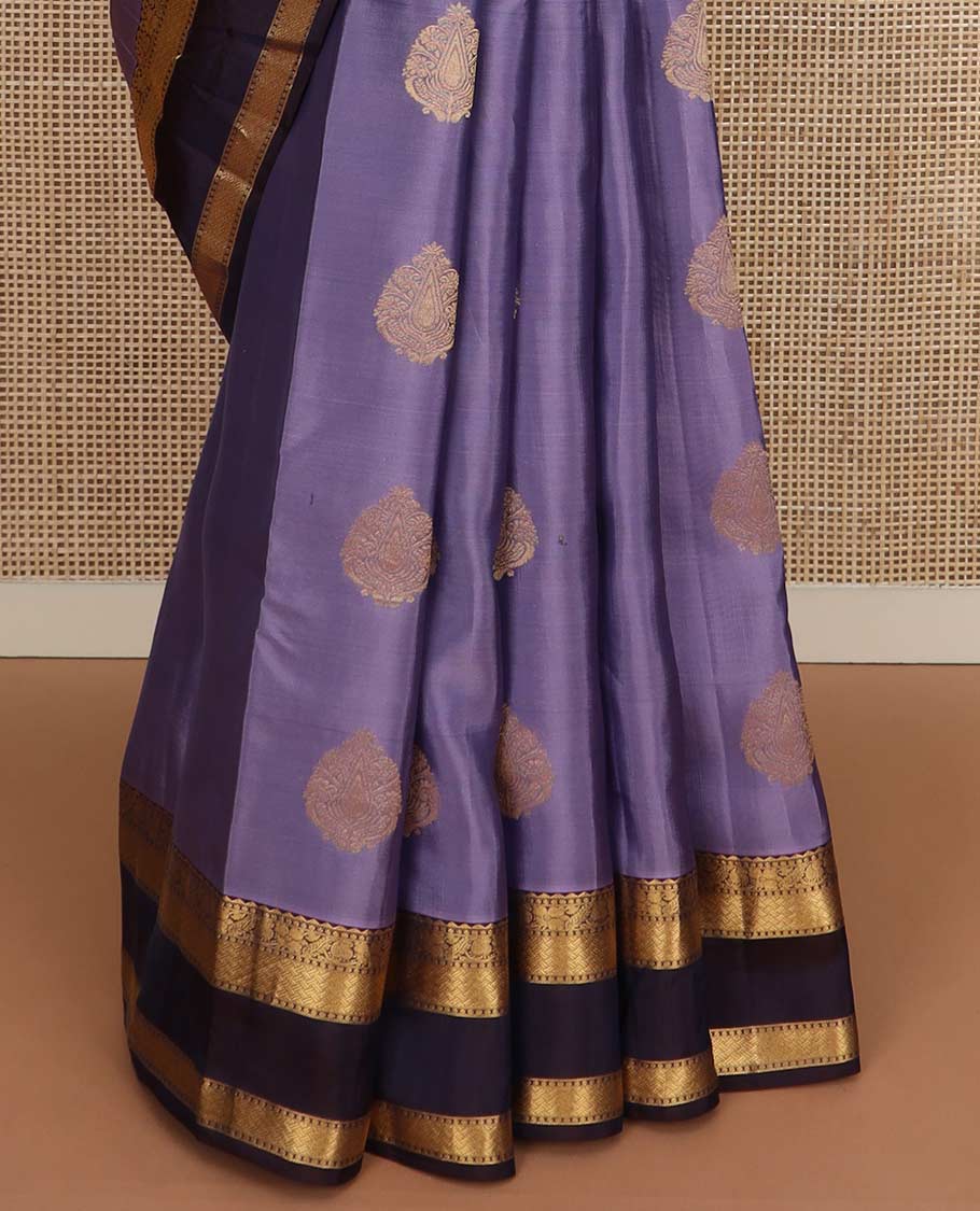 Lavender zari buttas Vasundhara silk mix saree, contrast rettai pettu border of manga, floral, and paiyaadi kattam designs, and zari design pallu