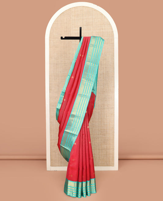 Red Vasundhara Lite Silk Mix Saree, Meticulously Crafted with Zari Buttas and Zari Stripes, Complemented by Contrast Border of Rekku, Rudraksham, Kodi Visiry, Muthu, and Kamalam Designs, Pallu Featuring Scallop Designs, and Paired with a Contrast Blouse