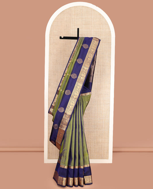 Olive Green Vasundhara Lite Silk Mix Saree, Mesmerized with Zari Buttas, Complemented by a Contrast Border of Muthu, Banaras, Rudraksham, and Mayil Designs, Pallu Elevated with Rudraksham Butta Enclosed Jaal Designs, and Paired with a Contrast Blouse