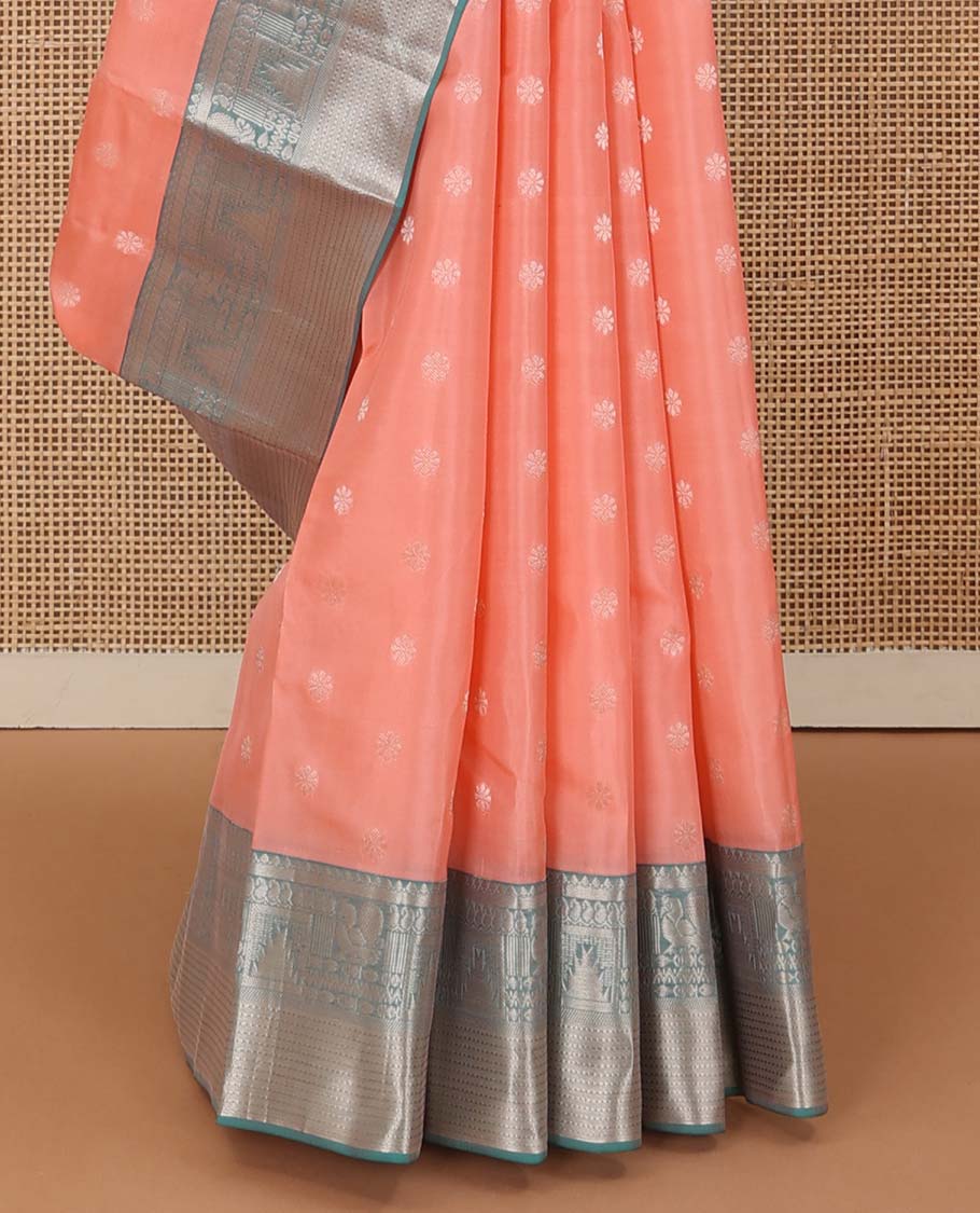 Peach zari buttas Vasundhara silk mix saree, contrast border of thilakam mokku, manga, mayil, neli, thazampoo rekku, and muthu designs, and jaal pallu