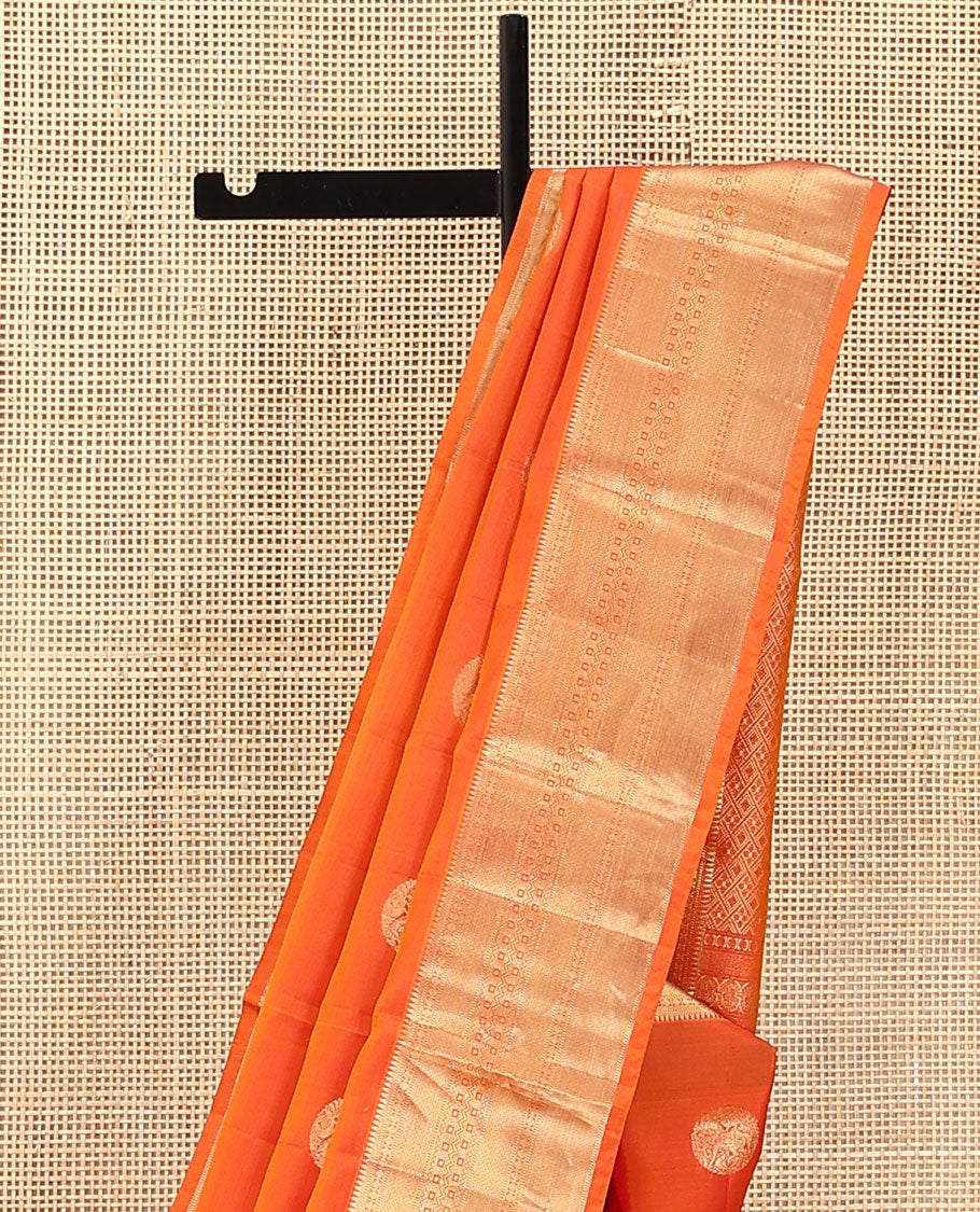 Orange Vasundhara Lite Silk Mix Saree, Showcasing Zari Buttas on Its Body, Highlighted by Zari Border of Rekku, Muthu, Rudraksham, Mayil Kann, and Chakram Designs, Grand Jaal Pallu, and Paired with a Matching Blouse