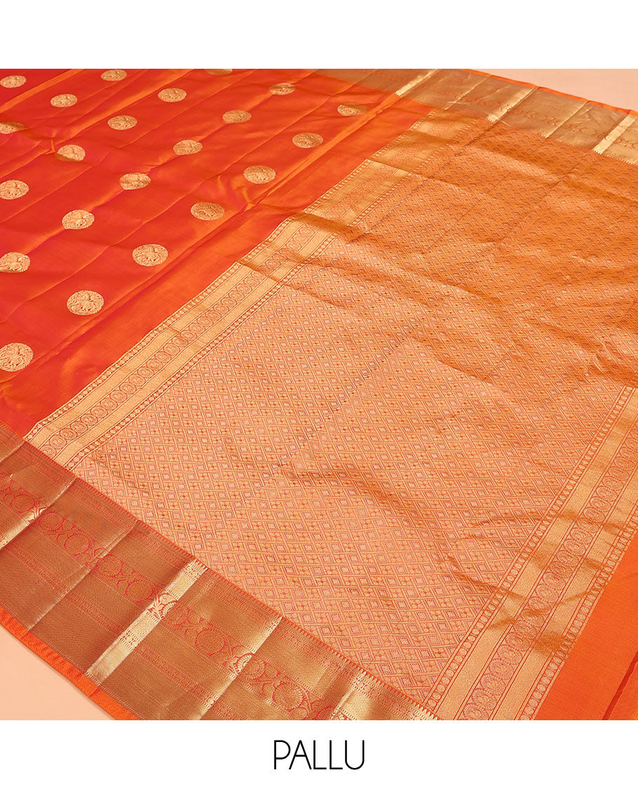 Orange Vasundhara Lite Silk Mix Saree, Showcasing Zari Buttas on Its Body, Highlighted by Zari Border of Rekku, Muthu, Rudraksham, Mayil Kann, and Chakram Designs, Grand Jaal Pallu, and Paired with a Matching Blouse