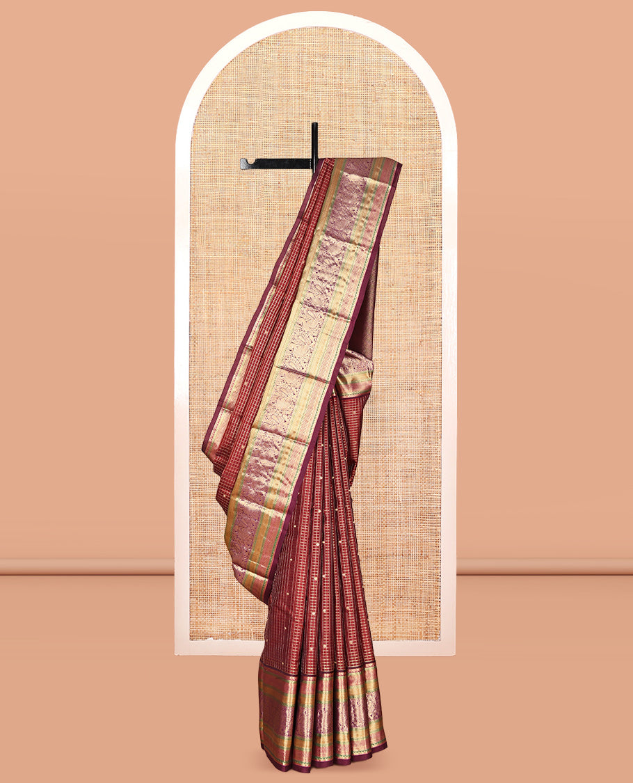 Maroon Vasundhara Lite Silk Mix Saree, Adorned with Zari Butta Enclosed Checks, a Zari Border of Rekku, Kuyil Kann, and Mayil Designs, Grand Pallu, and a Matching Blouse
