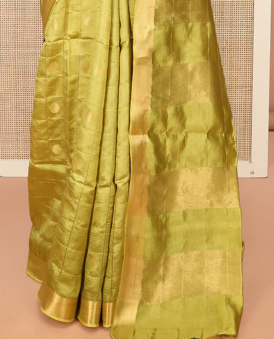 Green Banana Pith Saree Detailed with Polka Dot Buttas Enclosed Checks, Subtle Zari Border, Gleaming Zari Stripes Woven Pallu, and Paired with a Matching Plain Blouse