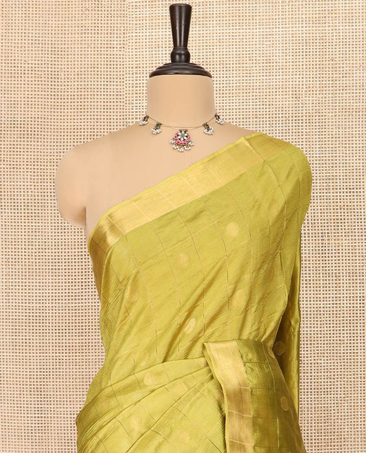Green Banana Pith Saree Detailed with Polka Dot Buttas Enclosed Checks, Subtle Zari Border, Gleaming Zari Stripes Woven Pallu, and Paired with a Matching Plain Blouse