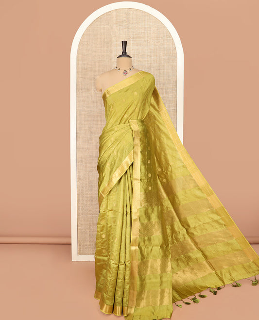 Green Banana Pith Saree Detailed with Polka Dot Buttas Enclosed Checks, Subtle Zari Border, Gleaming Zari Stripes Woven Pallu, and Paired with a Matching Plain Blouse