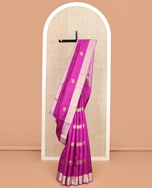 Rani pink mayil and yaanai buttas silk saree, contrast border of rekku, kathir, mayil, and yaanai designs, and pallu of geometric patterns