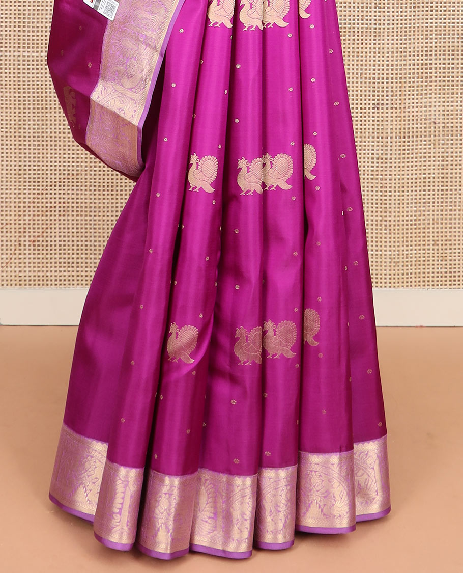 Rani pink mayil and yaanai buttas silk saree, contrast border of rekku, kathir, mayil, and yaanai designs, and pallu of geometric patterns