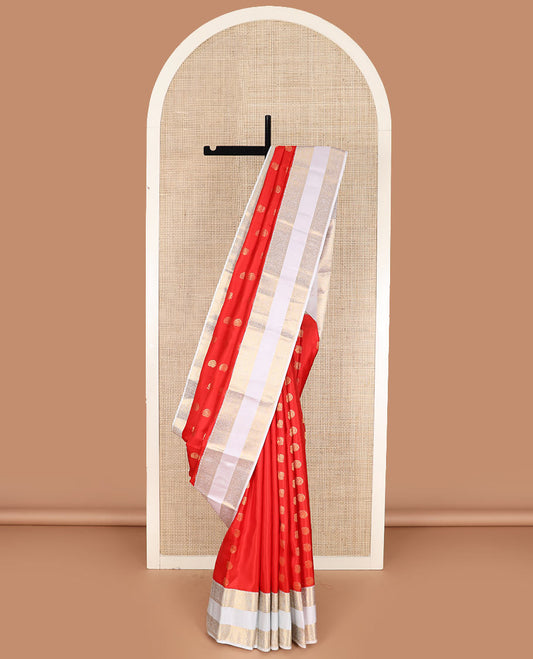 Orange arumbu manga buttas silk saree with contrast rettai pettu border of salngai, diamond, and kodi visiry designs, and intricate pallu