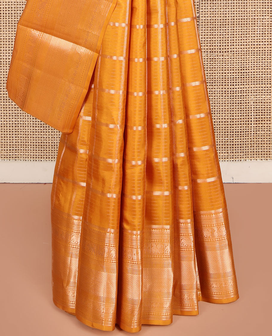 Yellow Vasundhara Silk Saree, Enriched with Zari Butta Enclosed Checked Design All Over Its Body, Highlighted by Zari Border of Thilakam Mokku, Muthu, Mayil, Yaanai, and Mayil Kann Designs, Grand Jaal Pallu, and Paired with a Matching Blouse