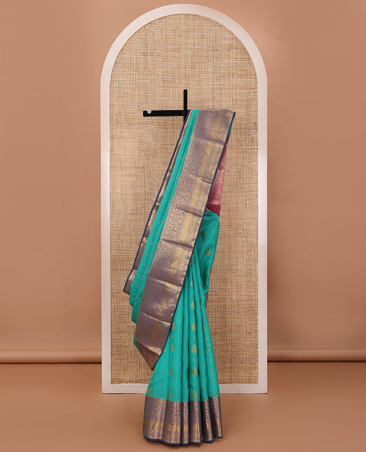 Persian green silk saree with zari buttas, contrast jaal pallu & border of floral, banaras, paisa & mayil kann designs
