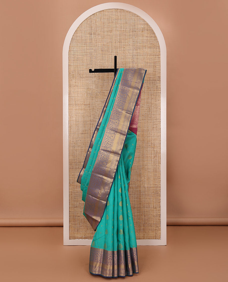 Persian green silk saree with zari buttas, contrast jaal pallu & border of floral, banaras, paisa & mayil kann designs